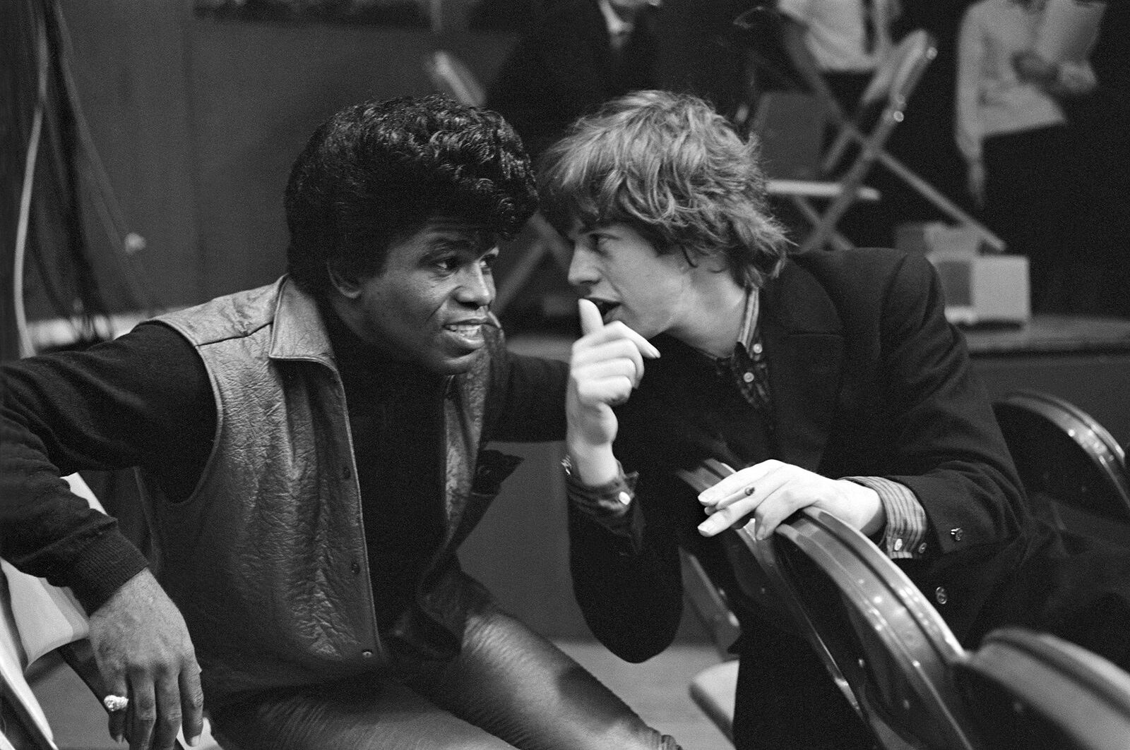 James Brown and Mick Jagger in conversation, backstage